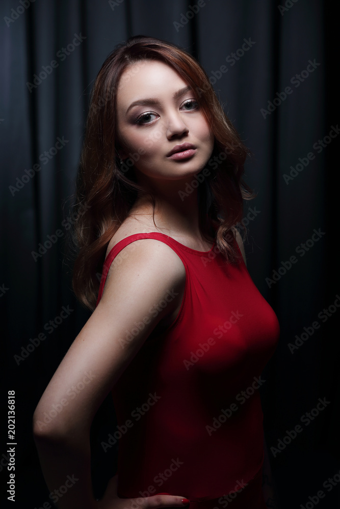 Fashionable young beautiful woman in a red dress Fashionable young beautiful woman in a red dress