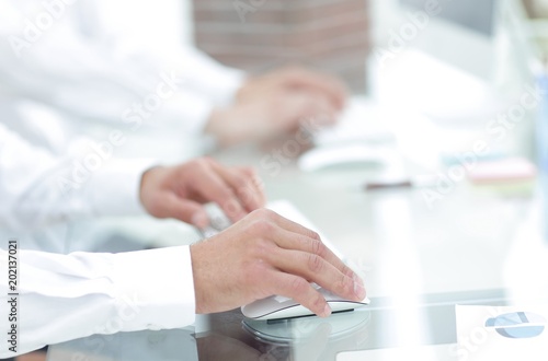 hands typing text on the computer keyboard. blurred business background.