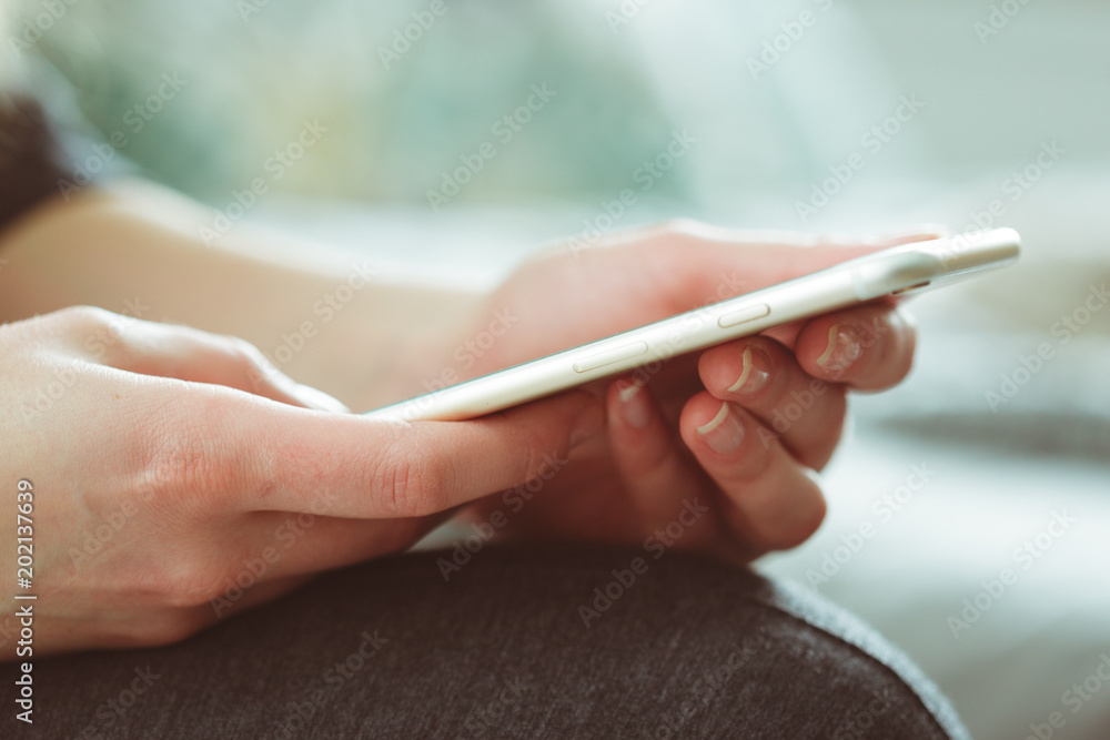 Woman typing write message on smart phone Woman typing write message on smart phone