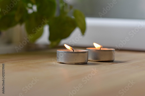 little candle cup light up on the wood table