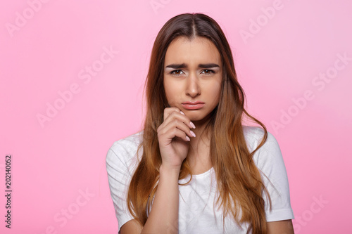 young woman on pink background Attractive beautiful woman showing air kiss