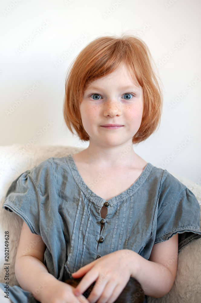 Red-haired girl with a surprised expression Red-haired girl with a surprised expression
