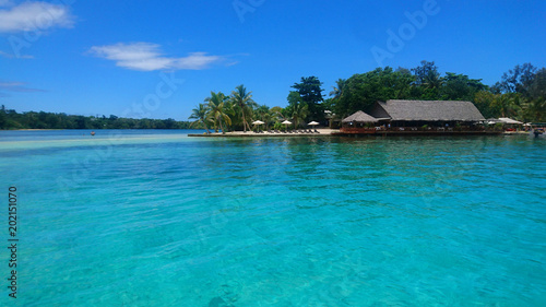 AERIAL: Flying near breathtaking oceanfront bar on spectacular exotic island.