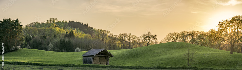 Sunset panorama with green hills in Germany