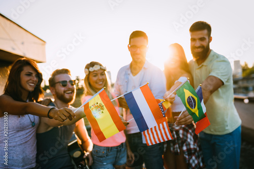 Group of people holding national flags photo