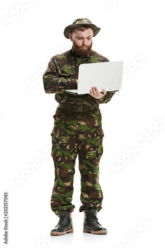 Young army soldier wearing camouflage uniform isolated on white