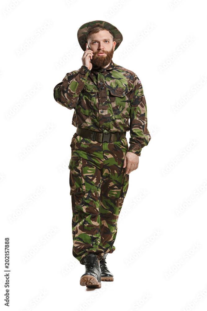 Young army soldier wearing camouflage uniform isolated on white Young army soldier wearing camouflage uniform isolated on white