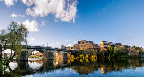 Landscape of the city of Barcelos, district Braga, Portugal. Landscape on the river Cavado, Barcelos bridge, Paco dos Condes, water mill and church. Buildings all in stone and old with lots of history