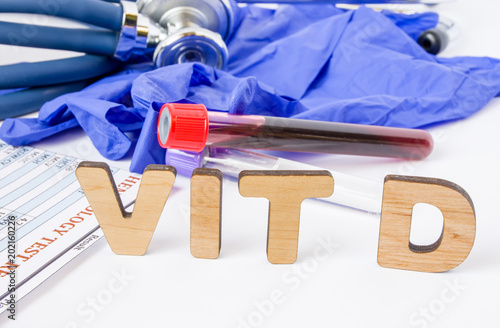 Vit D vitamin D acronym or abbreviation diagnostics or medical laboratory test photo concept. Word Vit D is background of blood sample in test tube, protective gloves and hematological blood analysis