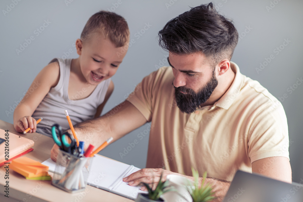 Busy father working from home Busy father working from home