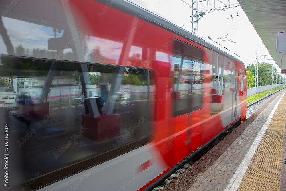Train with passengers moving by rail. Train with passengers moving by rail.