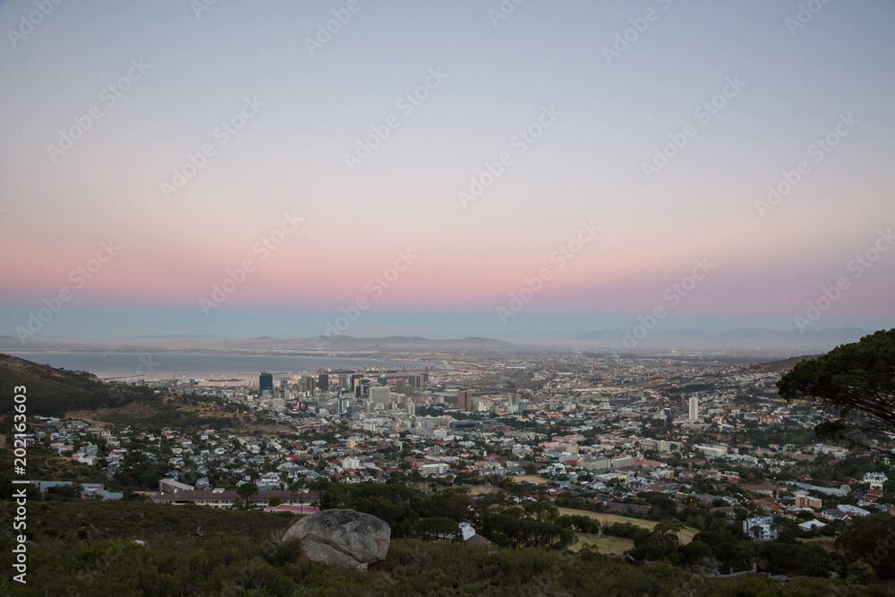 View of sun setting over City Bowl in Cape Town with colors View of sun setting over City Bowl in Cape Town with colors