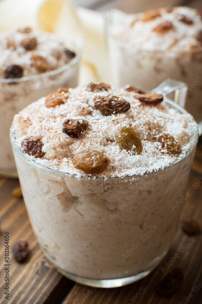 Rice pudding with coconut, cinnamon and raisins. Rice pudding with coconut, cinnamon and raisins.