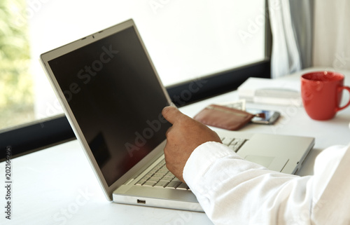 man using laptop in home