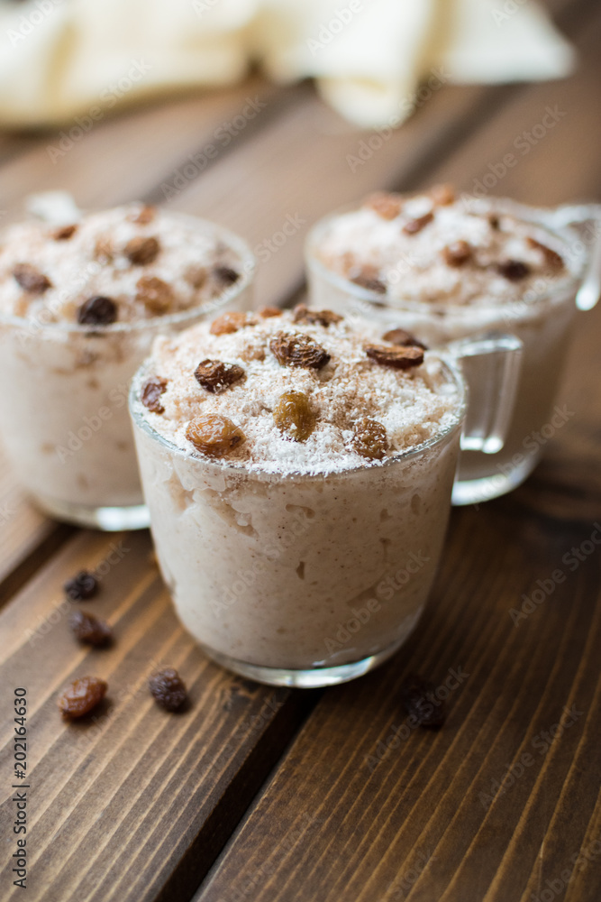 Rice pudding with coconut, cinnamon and raisins. Rice pudding with coconut, cinnamon and raisins.