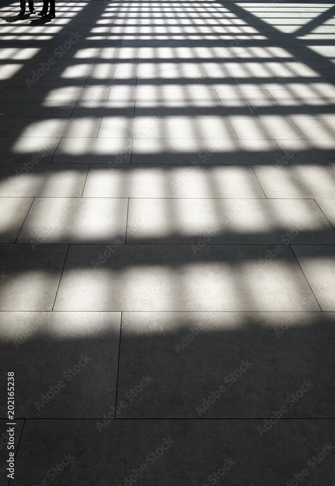 Lights and shadows on tiled floor by sunny day Lights and shadows on tiled floor by sunny day