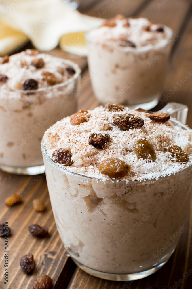 Rice pudding with coconut, cinnamon and raisins. Rice pudding with coconut, cinnamon and raisins.