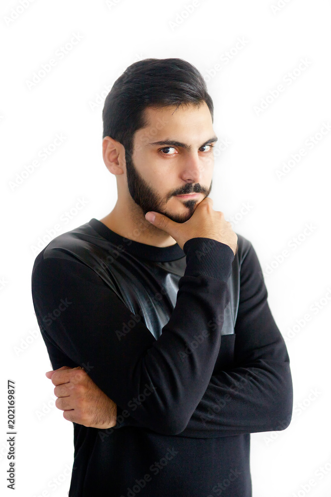 A man with a beard standing on white isolated background A man with a beard standing on white isolated background