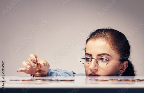 woman counting her savings photo