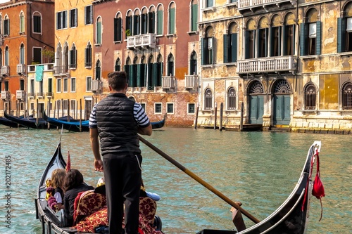 Venice - A romantic gondola ride on the Grand Canal of the Venice Lagoon in Italy. © Copula