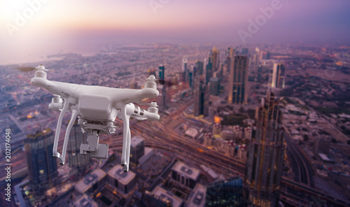 Photography multicopter drone flying over Dubai