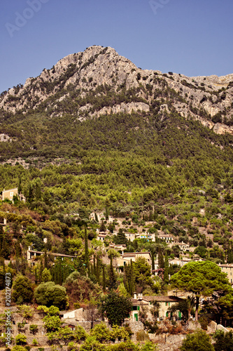 City of Deia on Mallorca island, Spain with a mountain in background
