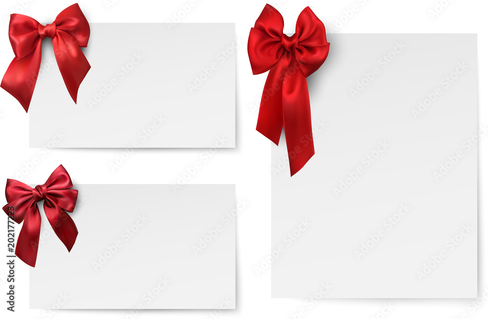 White paper cards with red satin bow. White paper cards with red satin bow.