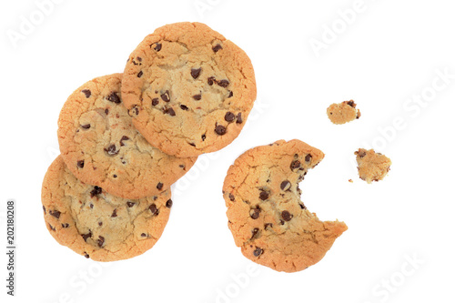 chocolate chip cookies one half eaten on white background