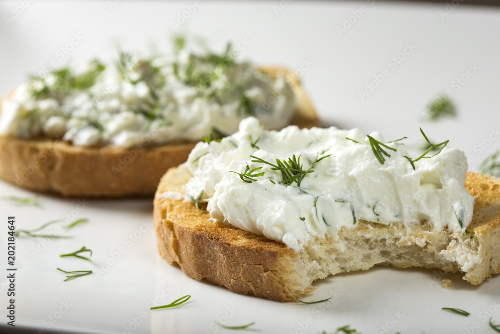 Sandwich with toast and homande cheese cream with fresh dill Sandwich with toast and homande cheese cream with fresh dill
