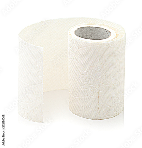 Small roll of toilet paper, isolated on white background with shadow reflection. Tissue paper roll on white reflective underlay. Long strip of perforated paper, wrapped around a paperboard core. photo