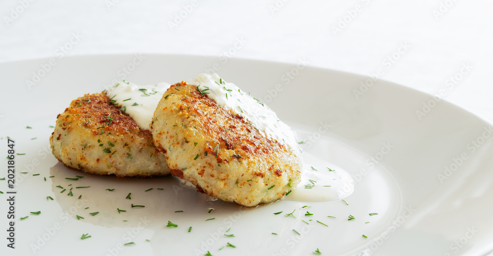 fish cutlets with sour cream mayo sauce sprinkled with dill fish cutlets with sour cream mayo sauce sprinkled with dill