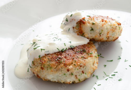 fried zander cutlets with sauce and dill