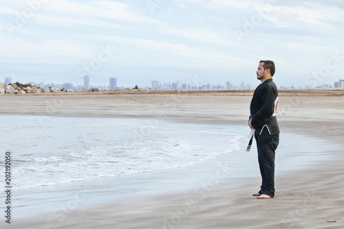 calm man doing some training in a kimono © beavera