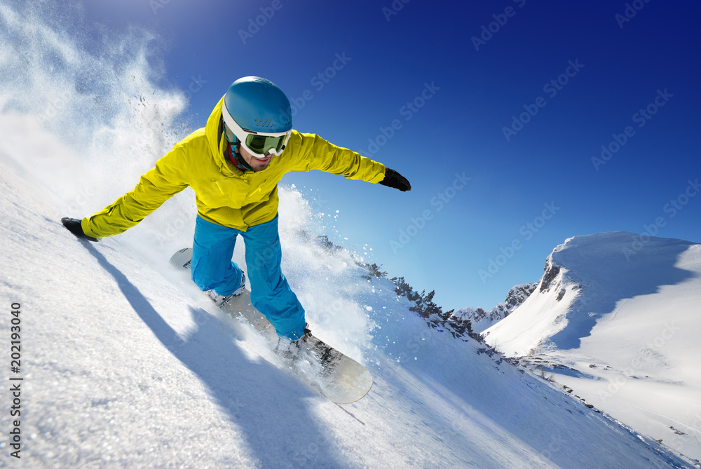 Skier in the freeride - mountains at sunny day.