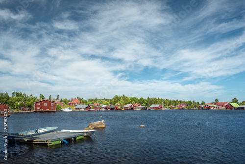 Fisherman village in Sweden at summer. View at a Swedish village on a lake.