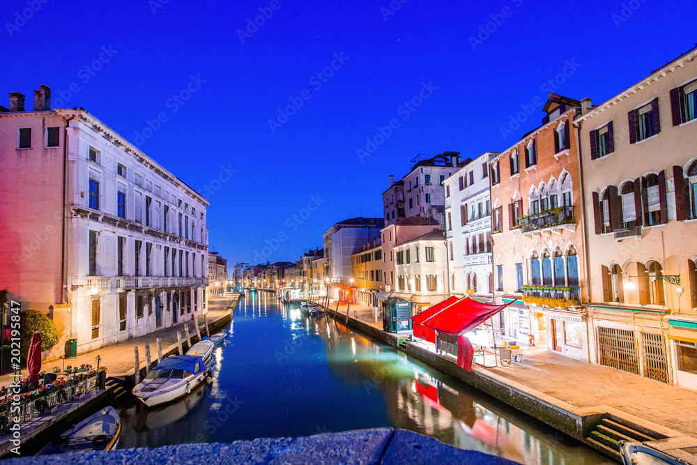 Canal view in Venice, Italy at blue hour before sunrise
