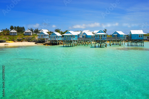 Beautiful tropical beach on Bermuda Island and houses on stilts