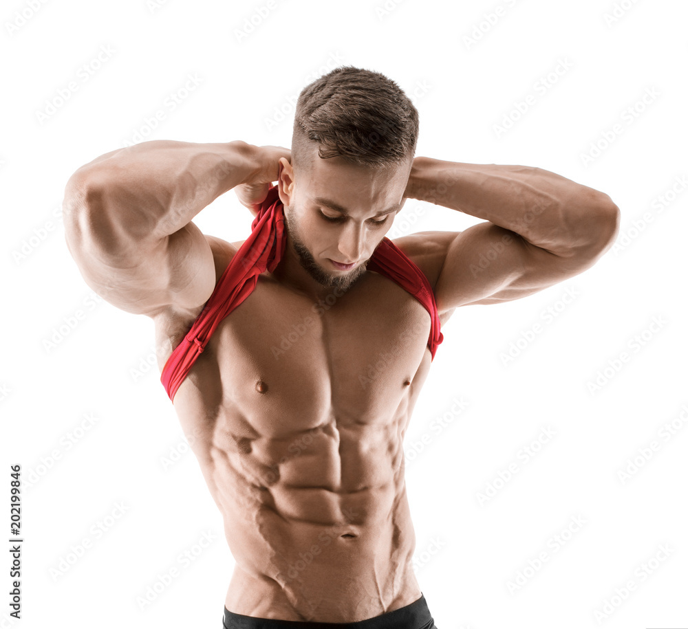 Cute young sports man shows relief abdominal muscles isolated on white Cute young sports man shows relief abdominal muscles isolated on white