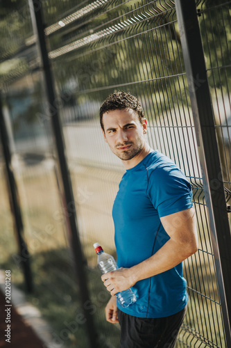 Young man drinking water
