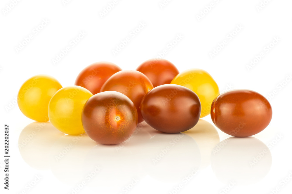 Grape cherry tomatoes mix isolated on white background yellow black red whole ripe collection stack. Grape cherry tomatoes mix isolated on white background yellow black red whole ripe collection stack.