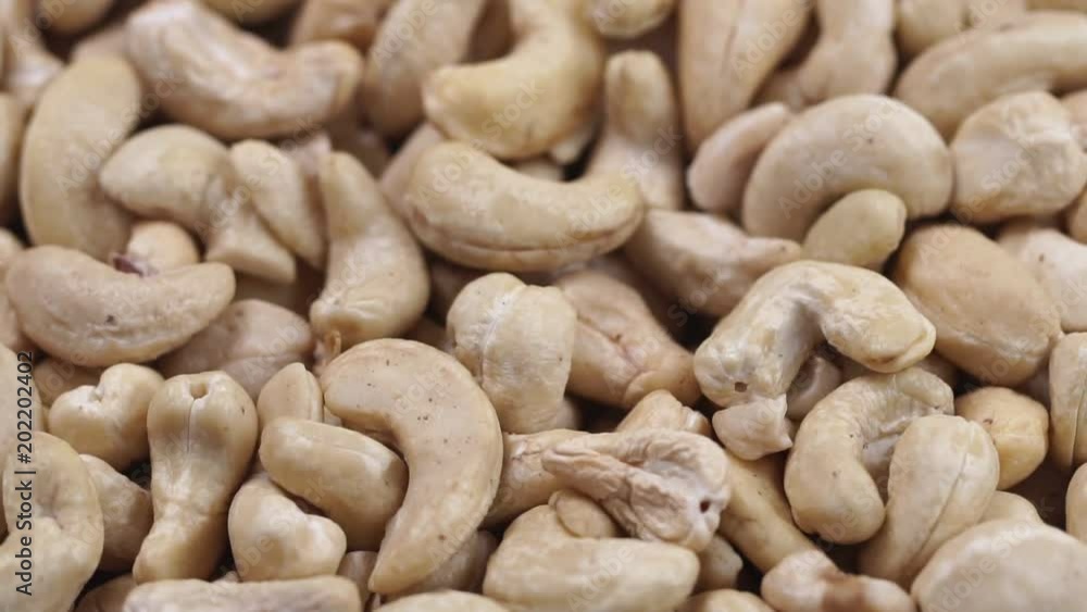 Cashew closeup. Rotating nuts background Cashew closeup. Rotating nuts background