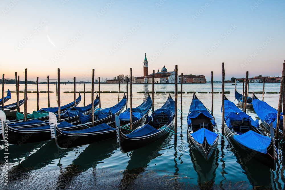 Gondolas in Venice, Italy at sunrise