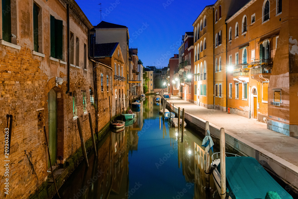 Canal view in Venice, Italy at blue hour before sunrise