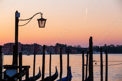 Street lamp and gondolas in Venice, Italy