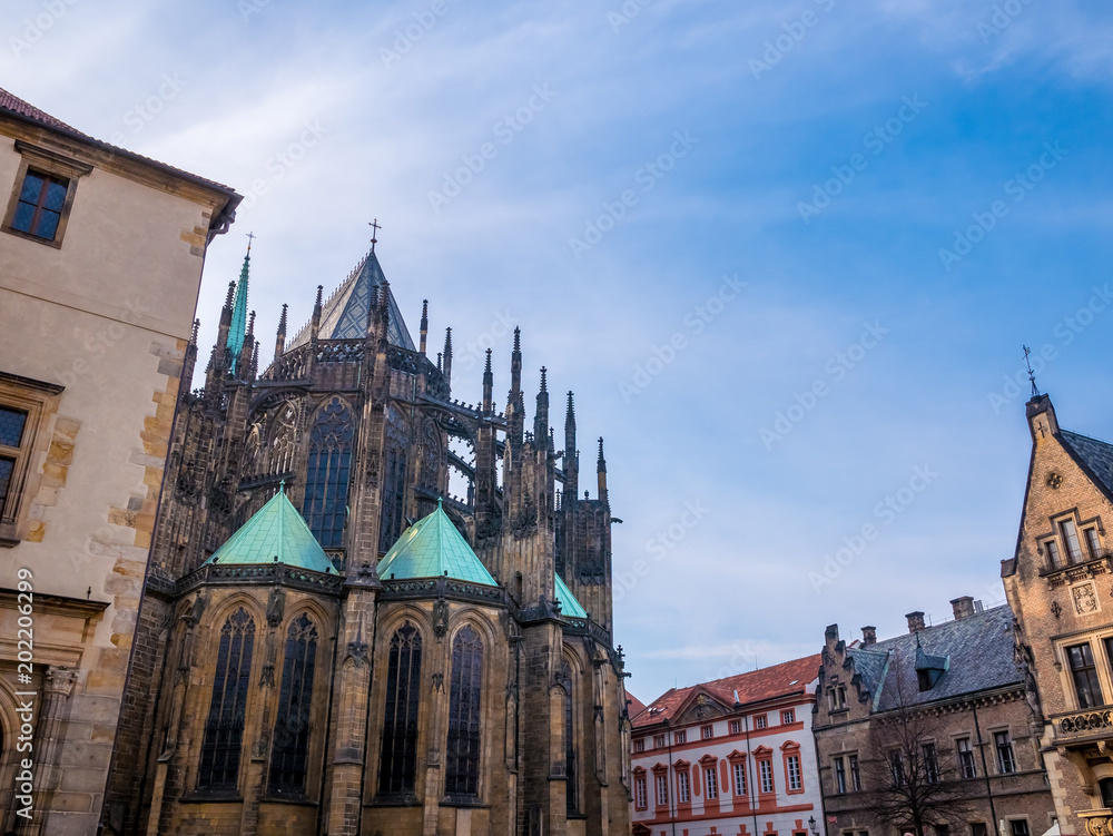 Fototapeta premium PRAGUE, CZECH REPUBLIC - FEBUARY 19, 2018 : St. Vitus cathedral in Prague Castle front view of the main entrance in Prague, Czech Republic.Blue sky sunny background winter season.Landmark historical