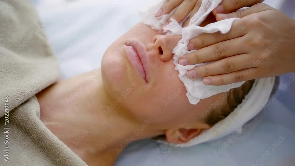 Close up shof of woman finishing cosmetic procedure. Close up shof of woman finishing cosmetic procedure.