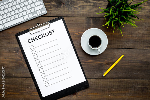 Fotografija Blank checklist with space for ticks on pad on office desk