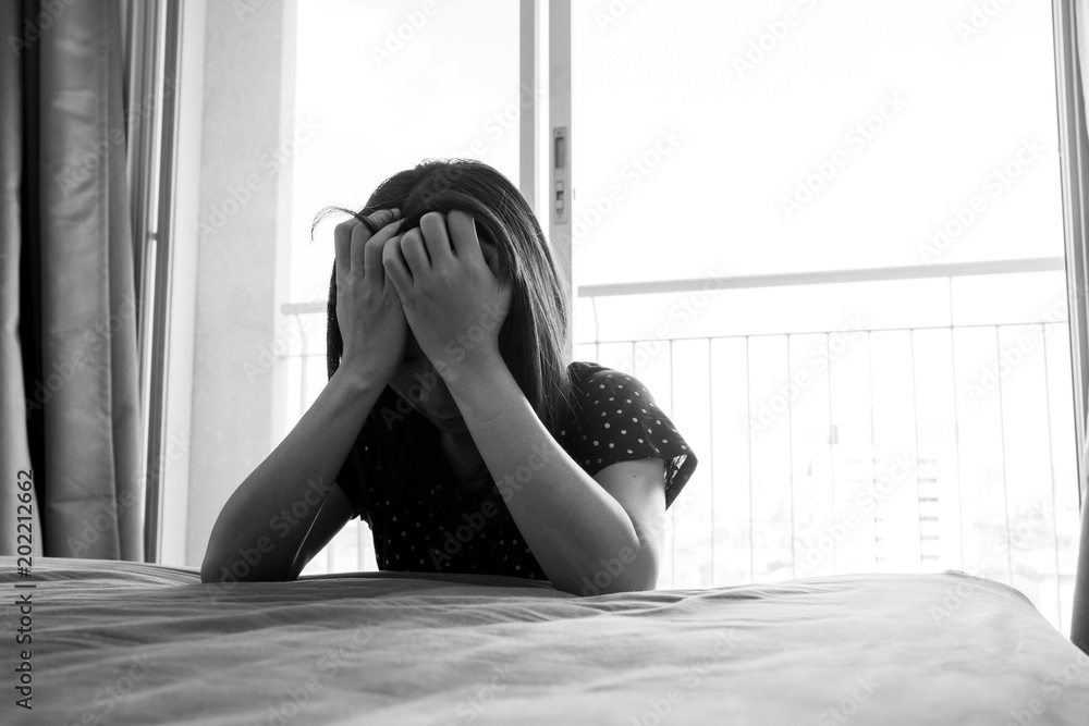 Dramatic black and white sad depressed woman sitting on the floor in ...