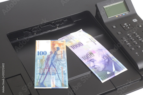 Printer printing Swiss francs, currency of switzerland photo