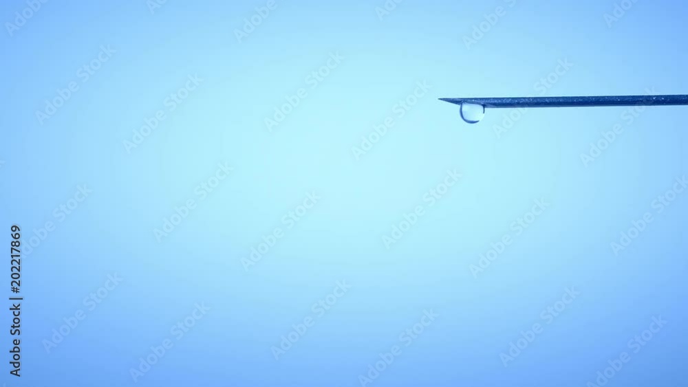 Drop on syringe needle. Medicine concept Drop on syringe needle. Medicine concept